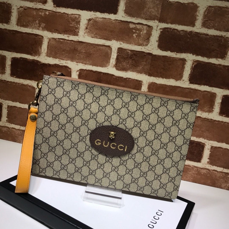 G*u*i clutch bags